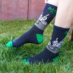 Thumbnail of A person pulls on a pair of the Sierra Nevada Bigfoot socks