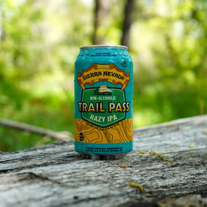 Thumbnail of Sierra Nevada Brewing Co. Trail Pass Hazy IPA 12oz. can sitting on a wooden surface on a hiking trail