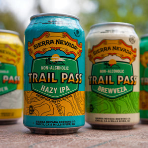 Thumbnail of Sierra Nevada Brewing Co. Trail Pass Hazy IPA 12oz. can sits at the foreground of a lineup of cans also including Trail Pass Brewveza and Trail Pass Golden