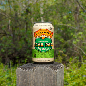 Thumbnail of Serra Nevada Trail Pass Brewveza non-alcoholic beer can on a wooden post with a natural background