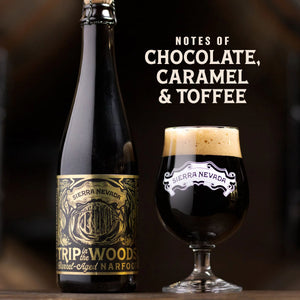 Thumbnail of A dark beer bottle labeled Sierra Nevada Trip to the Woods barrel-aged narcan alongside a stemmed glass of the same dark beer with a thick cream head, on a wooden surface with the text 'NOTES OF CHOCOLATE, CARAMEL & TOFFEE' on a dark background.