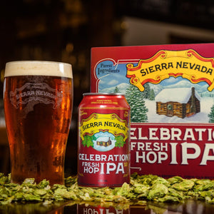 Thumbnail of Celebration IPA can, pint and 12-pack in a bed of hops