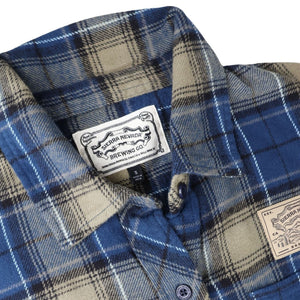Thumbnail of Blue and beige plaid shirt with a brand label on a white background