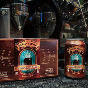 Thumbnail of Sierra Nevada Coffee Stout can sitting next to a 6-pack box with coffee roasting equipment in the background