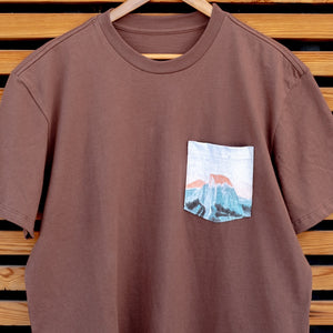 Thumbnail of Brown t-shirt with a pocket design on a wooden background