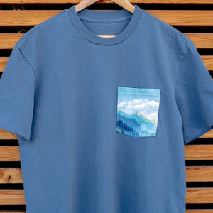 Thumbnail of Blue t-shirt with a pocket design on a wooden background