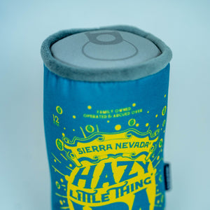 Thumbnail of A plush can-shaped can cooler featuring a blue and yellow design with 'SIERRA NEVADA HAZY LITTLE THING IPA' printed on it, set against a light blue-gray background.