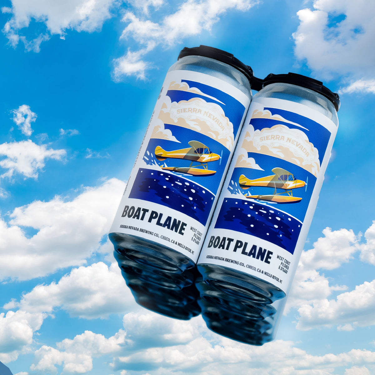 Two cans of 'Boat Plane' beer against a blue sky with clouds