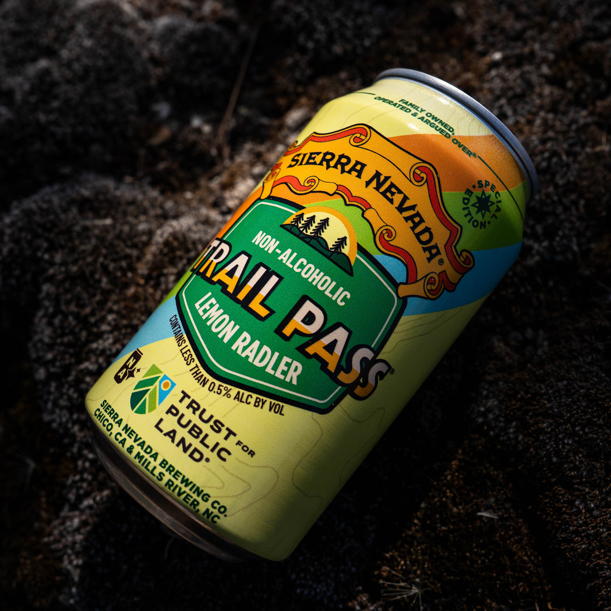 Sierra Nevada Trail Pass non-alcoholic lemon radler can on dark textured surface