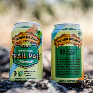 Thumbnail of Two cans of Sierra Nevada Trail Pass Non-Alcoholic Lemon Radler on a natural background
