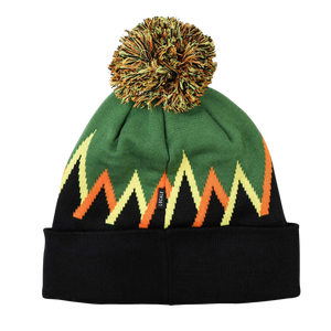 Thumbnail of A knit beanie hat with a black cuff, a green top section, and a zigzag pattern in yellow, orange, and black. It features a fluffy pom-pom on top and a small black brand tag on the side.