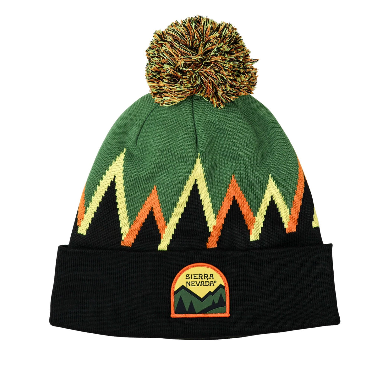 Green beanie with orange and yellow patterns and a pom-pom on a white background