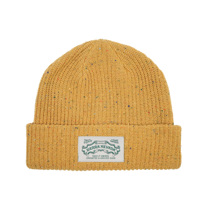 Thumbnail of A mustard yellow knit beanie hat with subtle multicolor flecks throughout, featuring a folded cuff and a white rectangular brand patch that reads 'Sierra Nevada'.