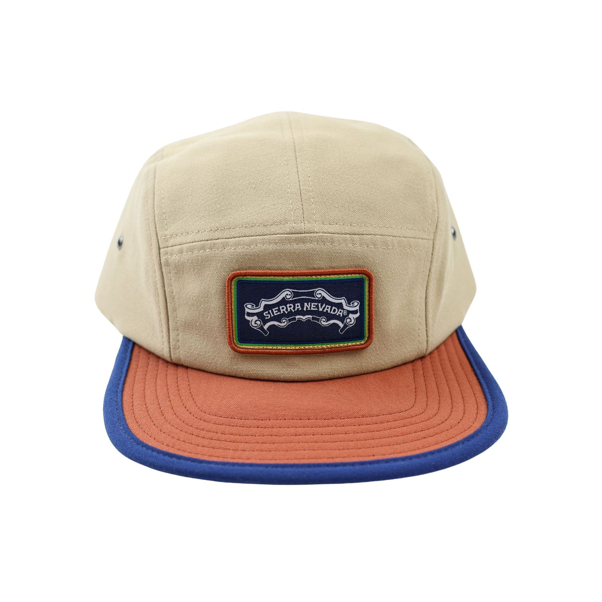 Beige cap with orange brim and blue rim featuring a logo on a white background