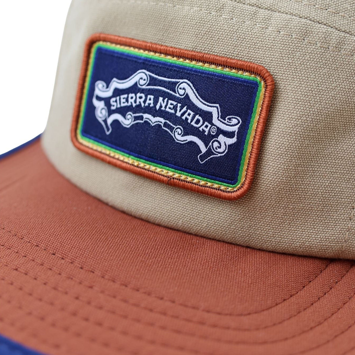 Beige and brown cap with Sierra Nevada logo patch on a white background