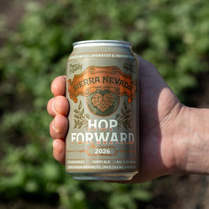 Thumbnail of Hand holding a Sierra Nevada 'Hop Forward 2026' beer can with a blurred green background