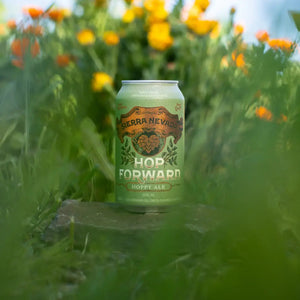 Thumbnail of Sierra Nevada Hop Forward Hoppy Ale can nestled in a garden surrounded by colorful flowers