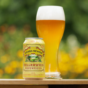 Thumbnail of A can and full glass of Sierra Nevada Kellerweis in front of a colorful garden