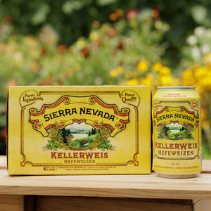 Thumbnail of A six-pack and can of Sierra Nevada Kellerweis in front of a colorful garden