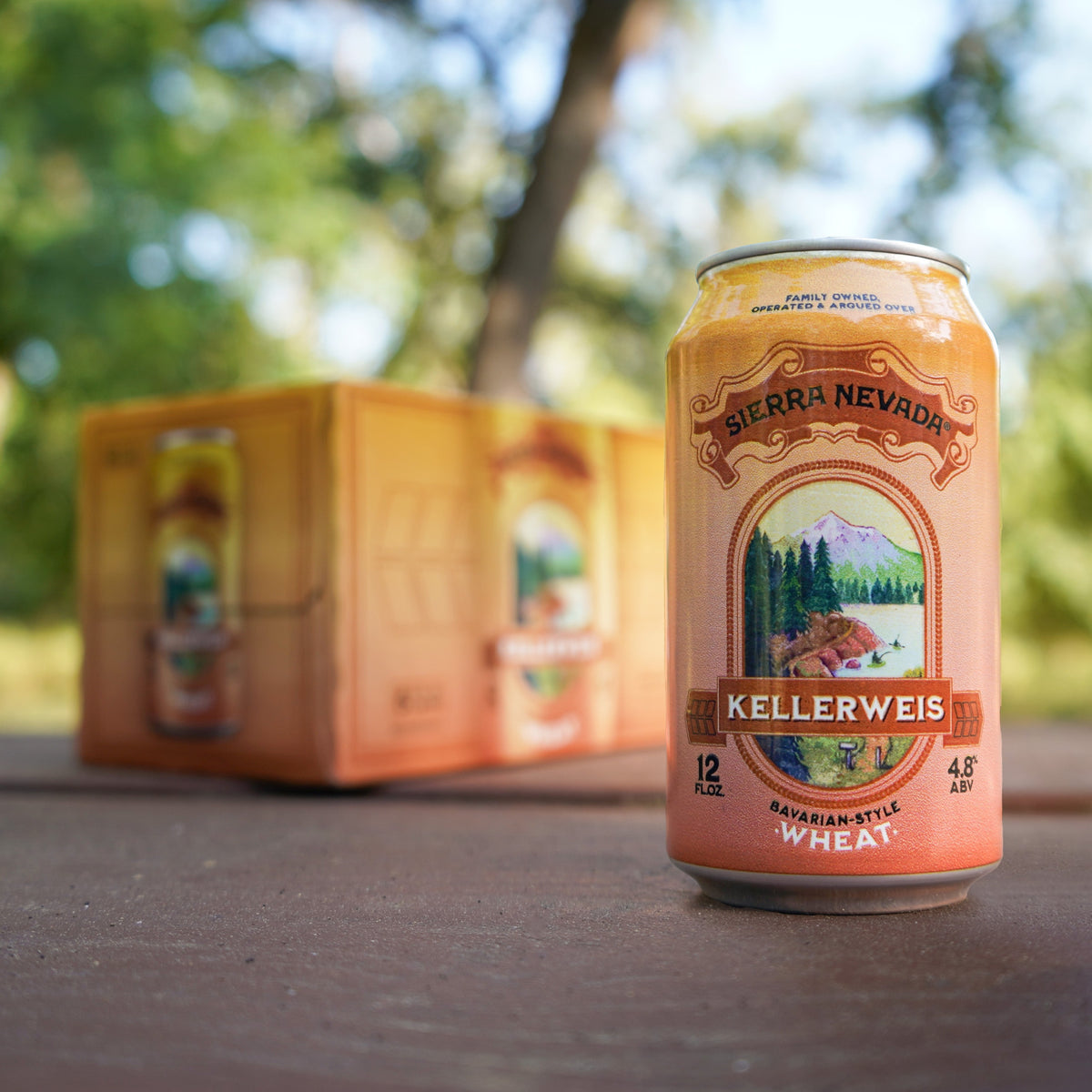 A 12oz. can of Sierra Nevada Kellerweis sitting in front of a 6-pack.
