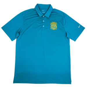 Thumbnail of A teal blue Nike polo shirt with a yellow crest on the left chest and a white Nike swoosh on the right sleeve, displayed flat against a white background.