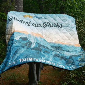 Thumbnail of Blanket with 'Protect our Parks' and Yosemite National Park text, displayed outdoors.
