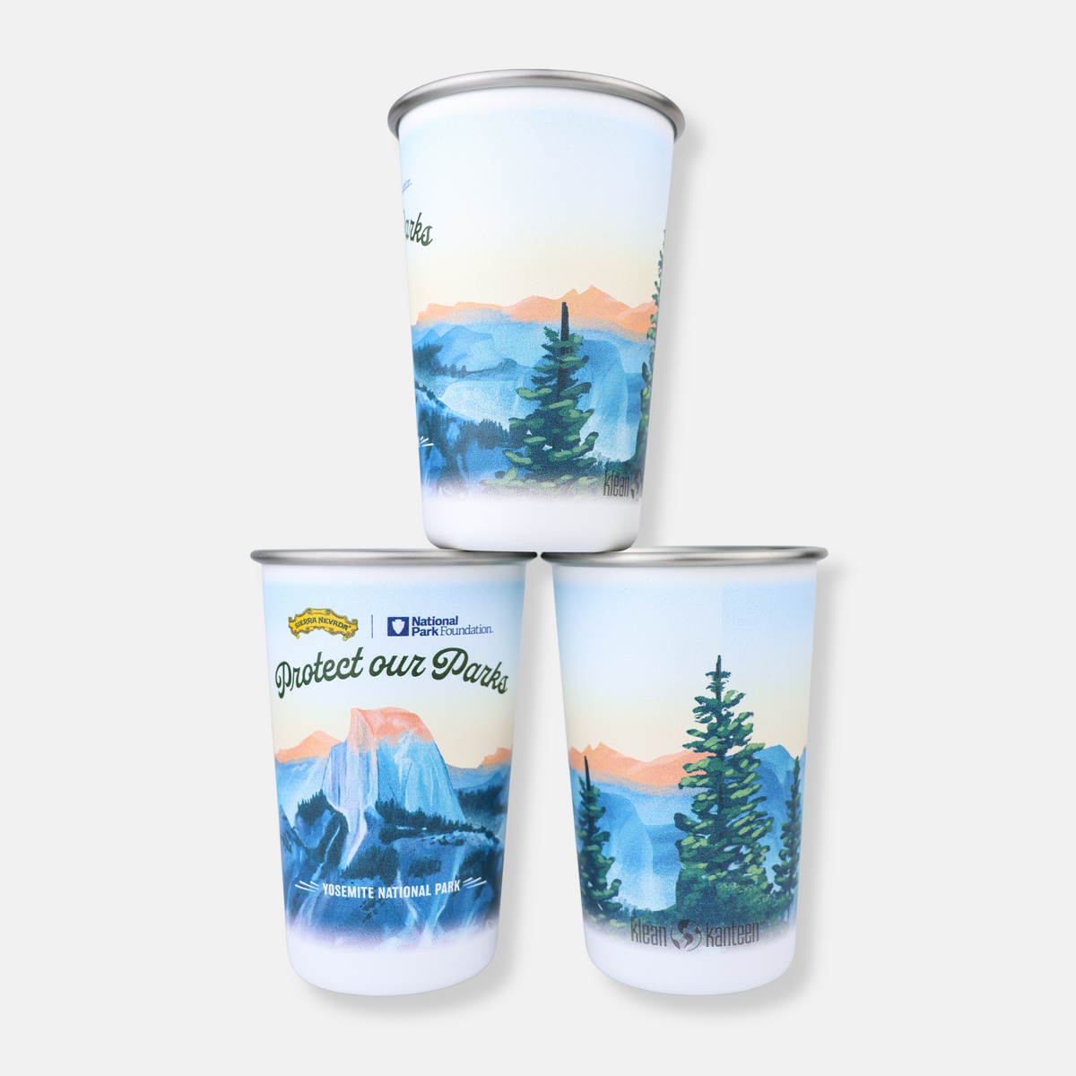 Three tumblers with nature-themed designs on a white background
