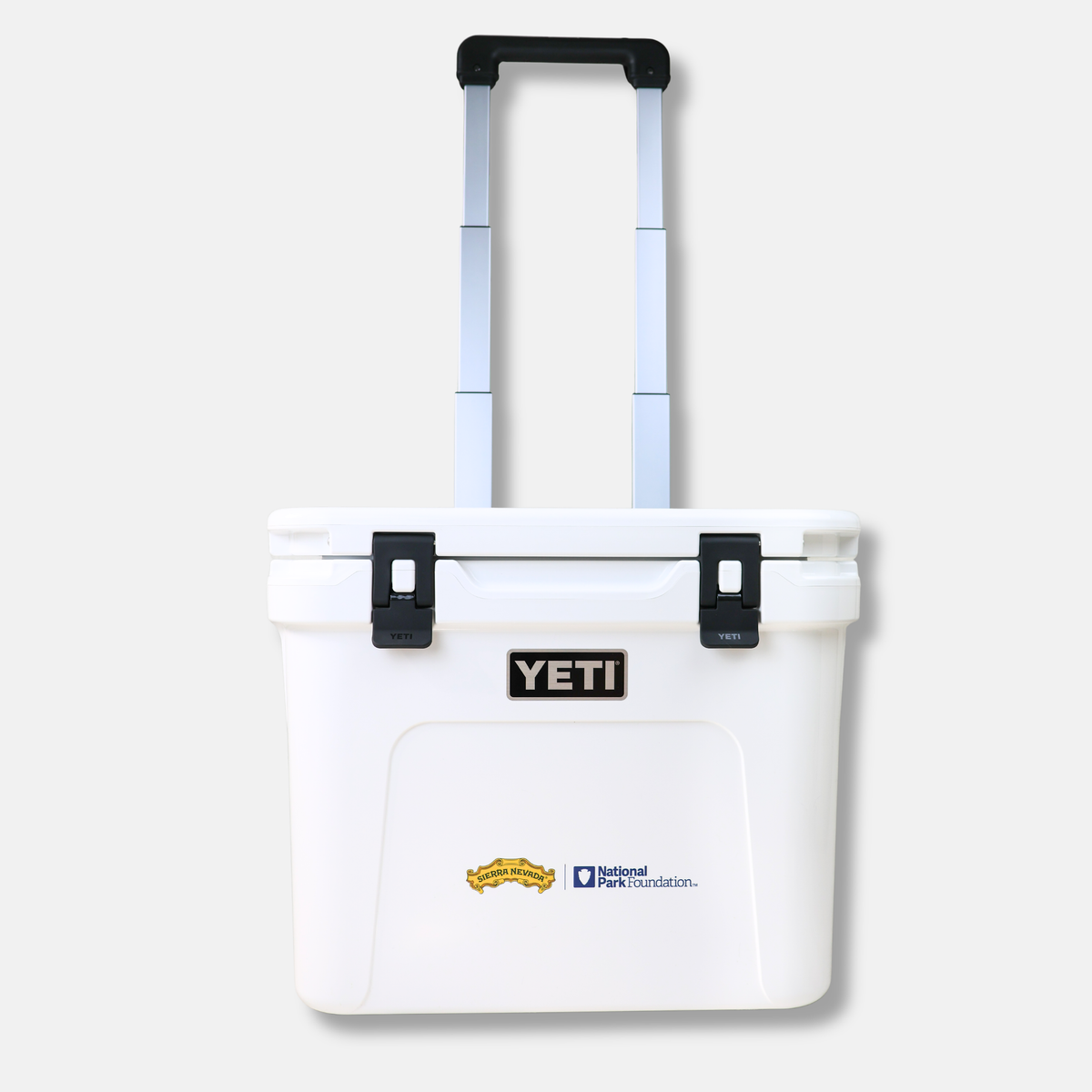 White YETI cooler bag with a handle on a white background