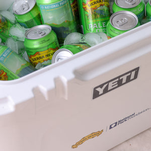 Thumbnail of Green beer cans in a YETI cooler