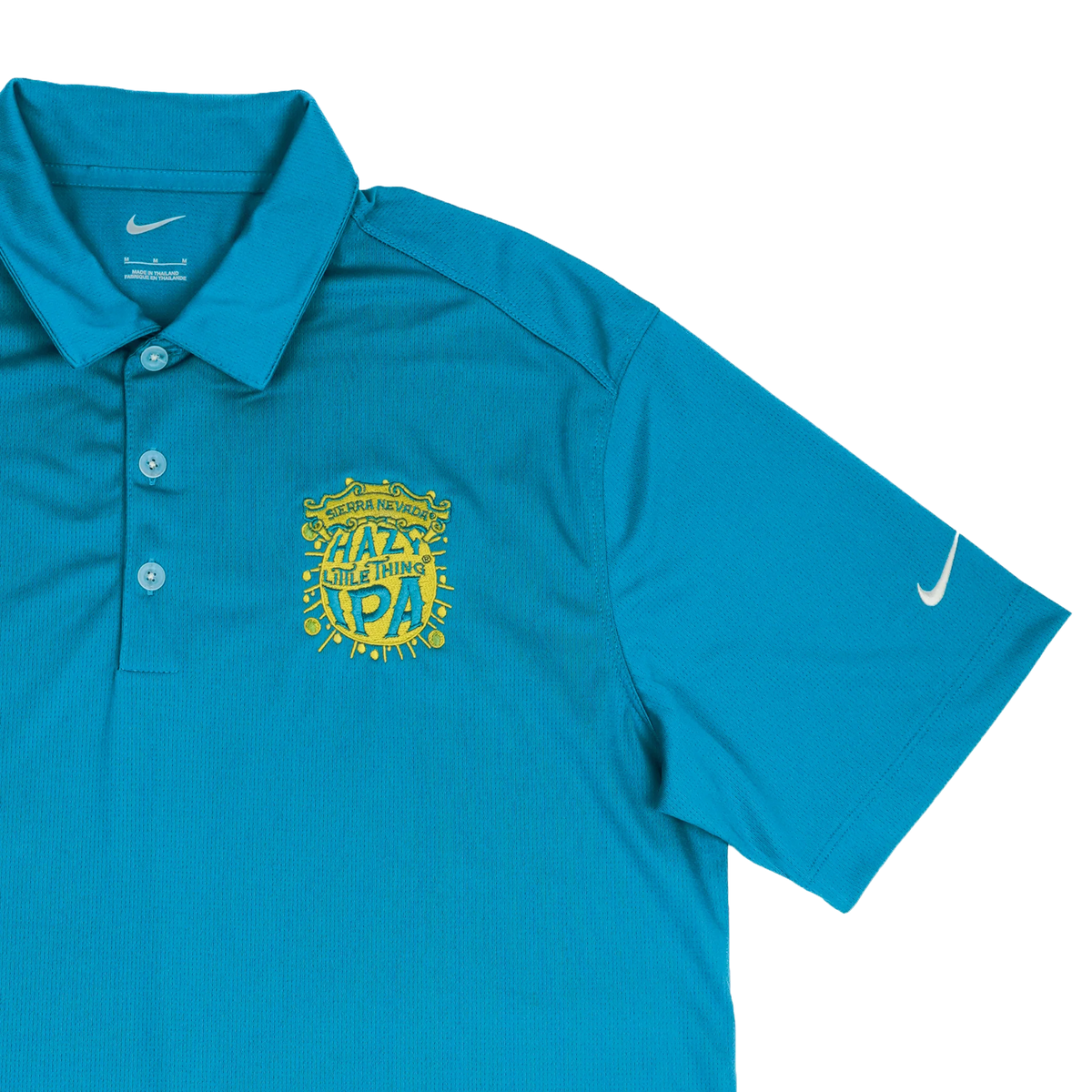 Blue polo shirt with yellow logo and text on a white background