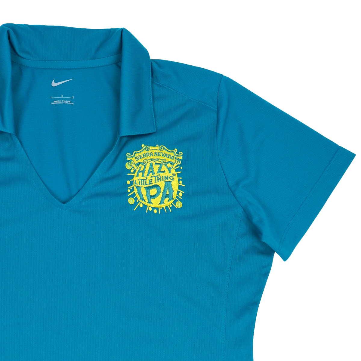Blue shirt with yellow graphic design on a white background