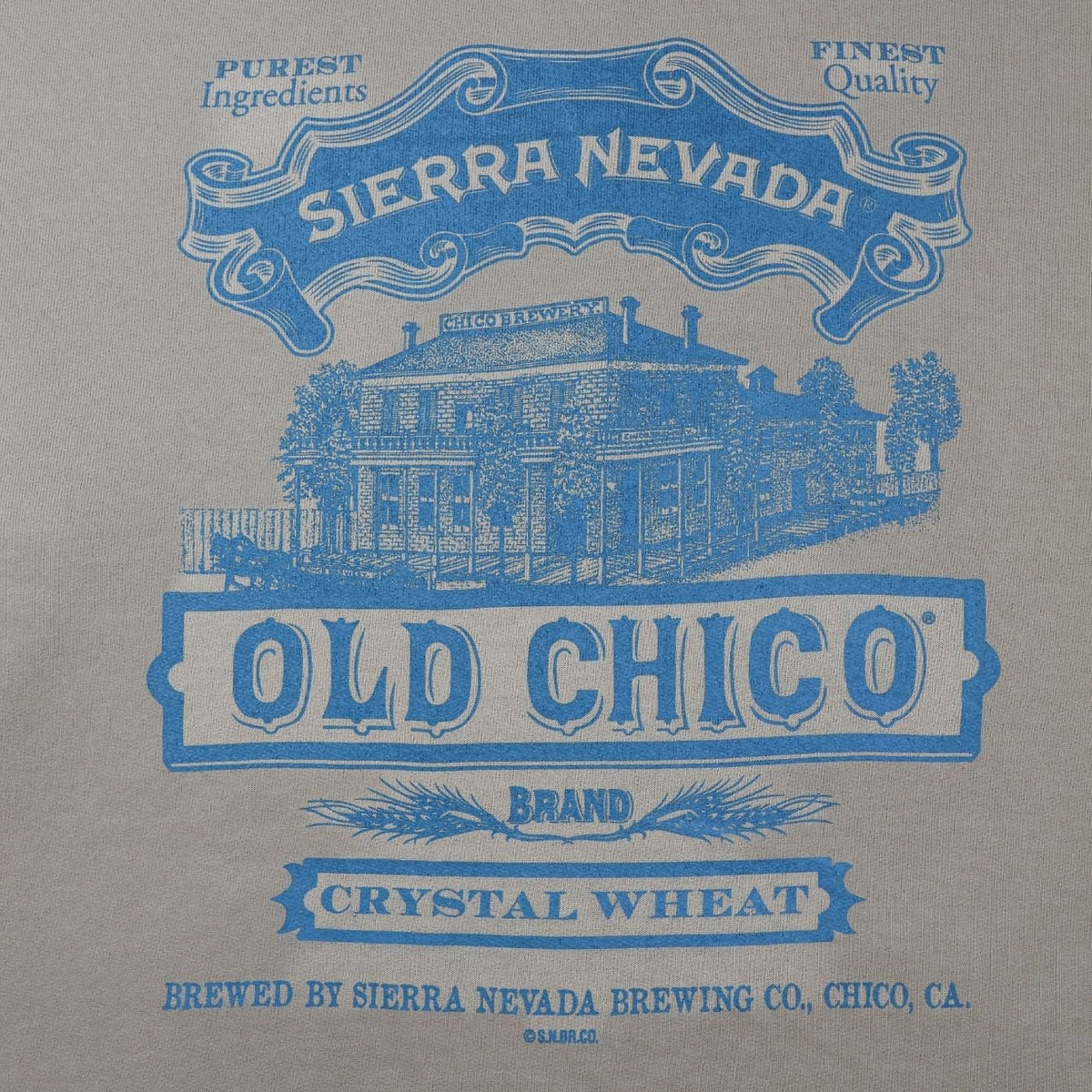 Beige hoodie with blue Sierra Nevada Old Chico branding on a white background