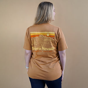 Thumbnail of Person wearing a brown t-shirt with 'Sierra Nevada' graphic on a beige background