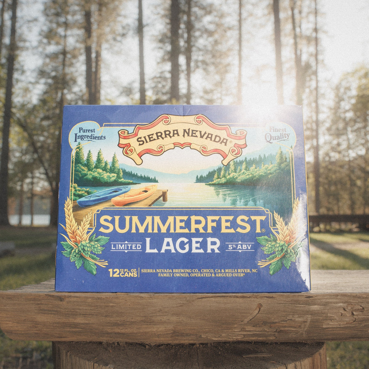 Sierra Nevada Summerfest Lager box on a wooden table with a forest background