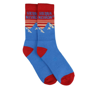 Thumbnail of Blue and red socks with mountain design and 'Sierra Nevada' text on a white background