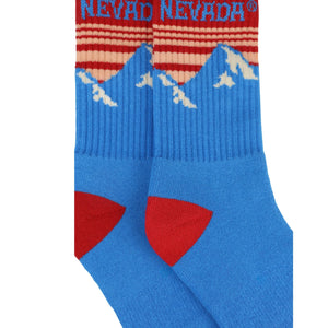 Thumbnail of Blue socks with red accents and 'Nevada' branding on a white background