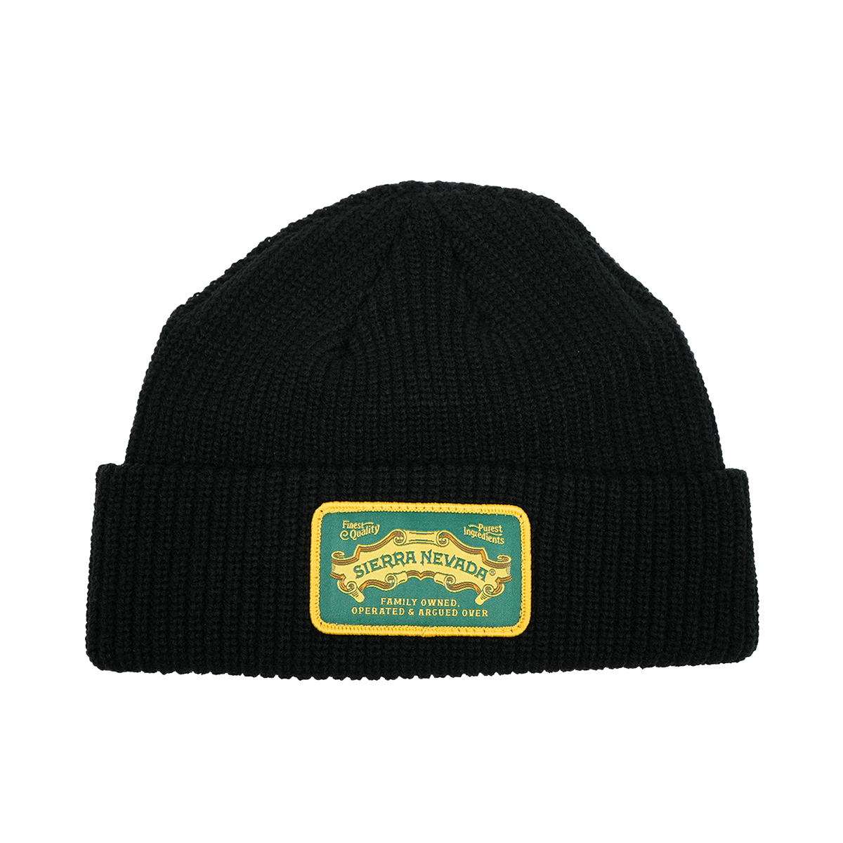 Black knit beanie with a yellow and green label on a white background