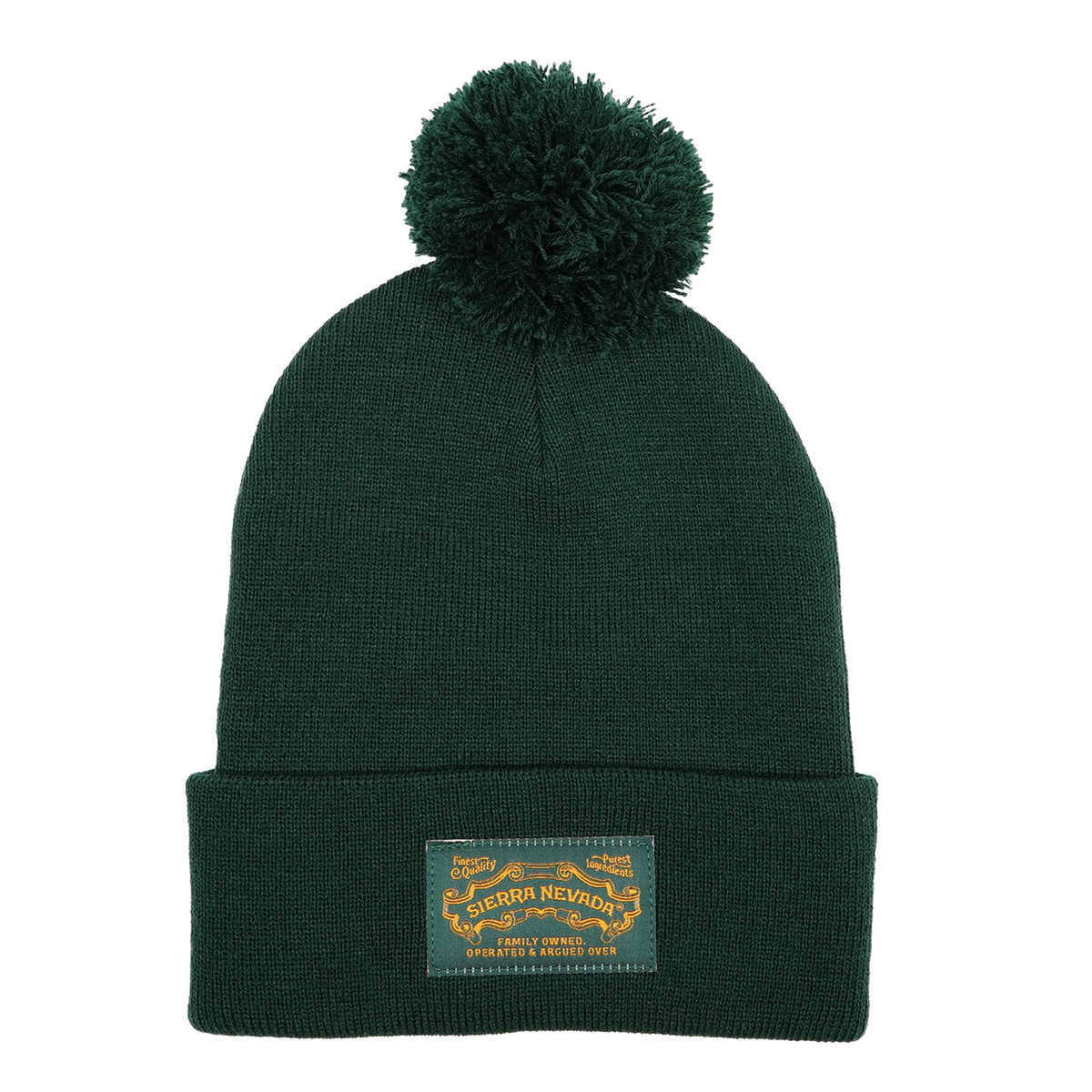 Green beanie with pom-pom and label on a white background