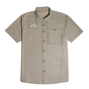Thumbnail of A short-sleeve button-up shirt in a light taupe-beige color, featuring a chest pocket and a small embroidered logo on the left chest, displayed against a solid white background.