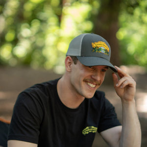 Thumbnail of Sierra Nevada Brewing Co. Grey Trucker Hat worn by a man in a campground