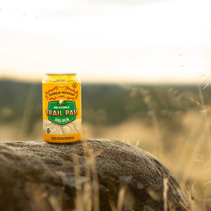 Thumbnail of Sierra Nevada Brewing Co. Trail Pass Golden Non-Alcoholic Brew - A chilled can of Trail Pass Golden sits on a rocky overlook