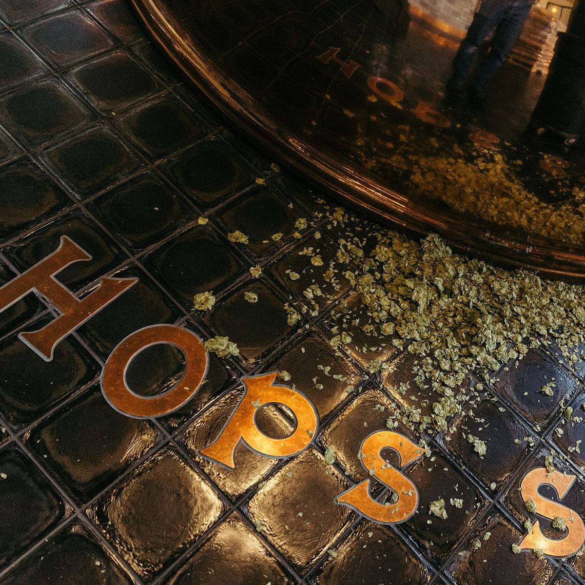 Hops on the ground of the brewhouse inside Sierra Nevada Brewing Co.