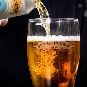 Thumbnail of A close-up of the pour from a can of Sierra Nevada Pale Bock into a pint glass featuring the Sierra Nevada scroll logo.