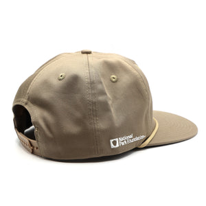 Thumbnail of Beige cap with a logo on a white background
