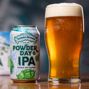 Thumbnail of Sierra Nevada Powder Day IPA can next to a freshly poured pint glass