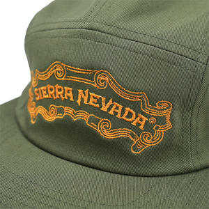 Thumbnail of Close-up of an olive green baseball cap with orange embroidered 'SIERRA NEVADA' text and decorative scrollwork on the front panel.