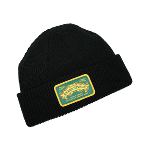 Thumbnail of Black beanie with a gold and green label on a white background