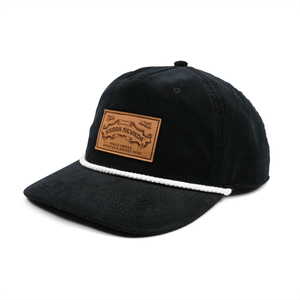 Thumbnail of Black cap with a leather patch on a white background