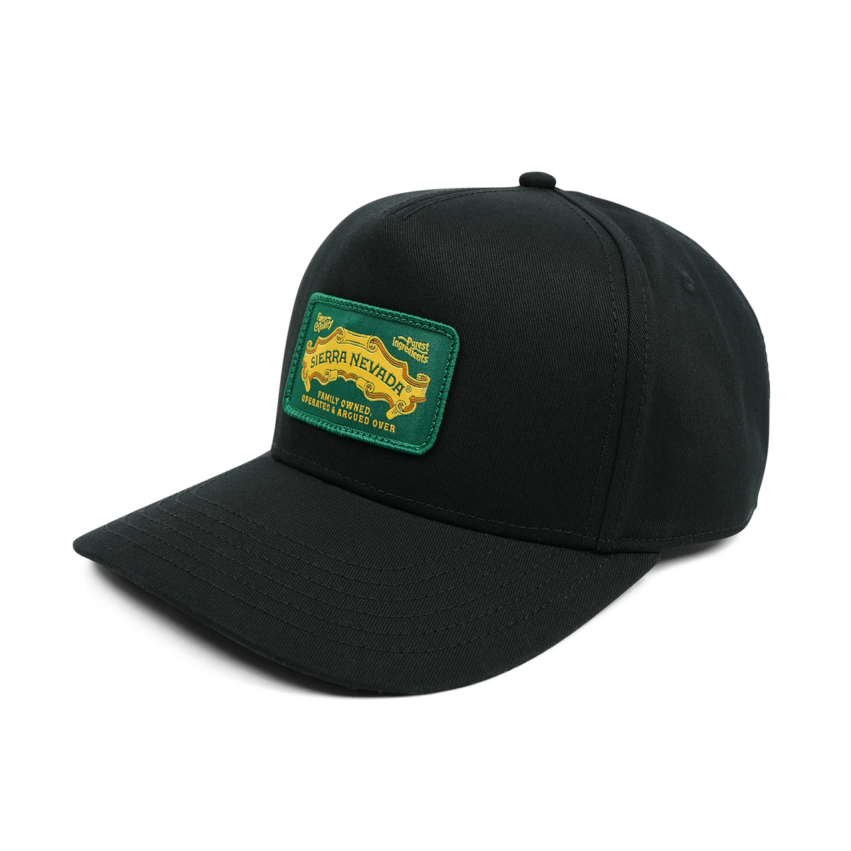 Black cap with a green and yellow patch on a white background