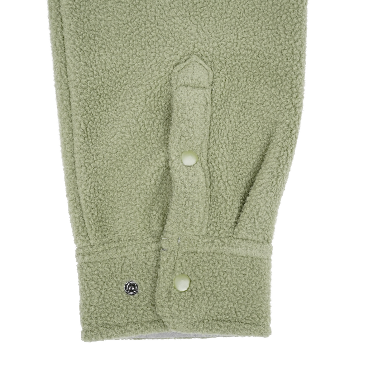 Close-up of a green fleece jacket with button details on a white background